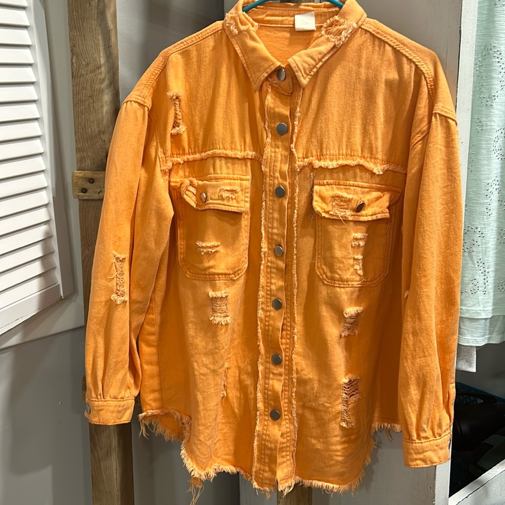 Orange, super cute, very distressed denim type shirt. Small runs med/ large